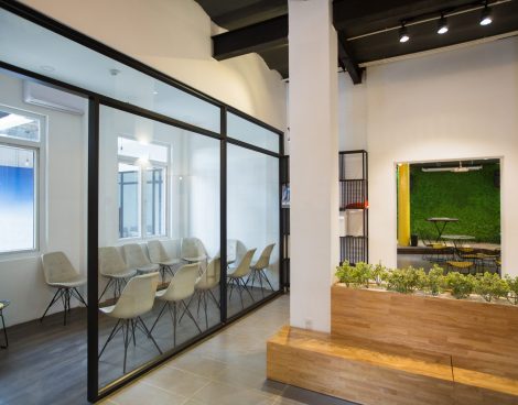 Nobody in office lobby with wooden bench